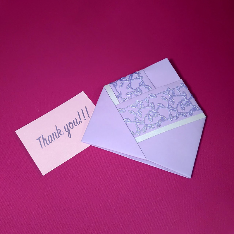 A stack of bamboo envelopes in a custom size