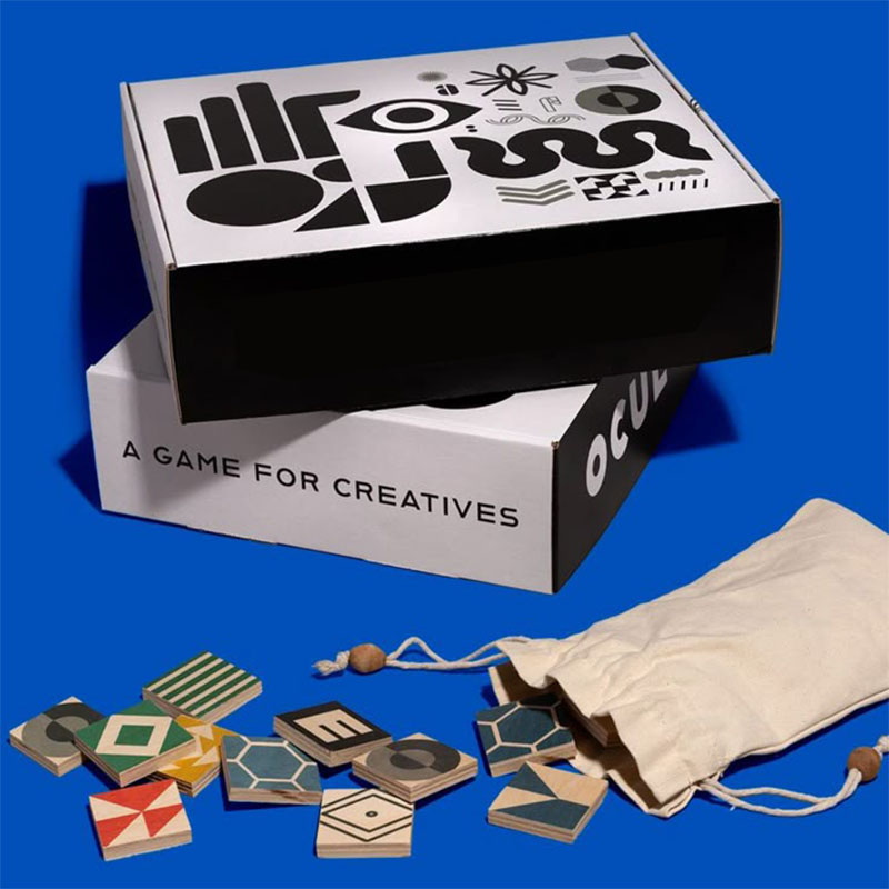 A stack of board game boxes in a custom size