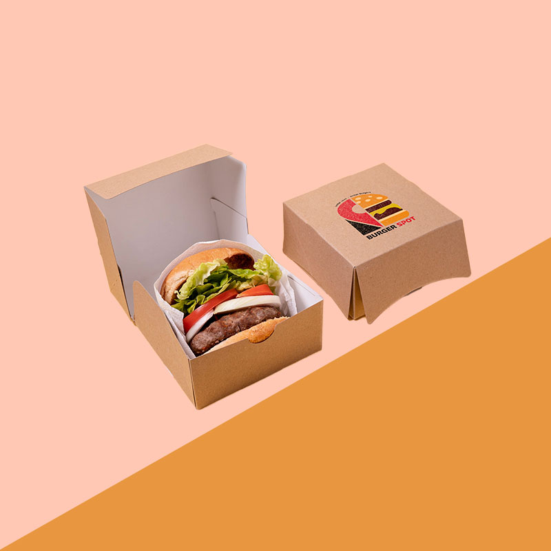 A stack of burger clamshell boxes in a custom size
