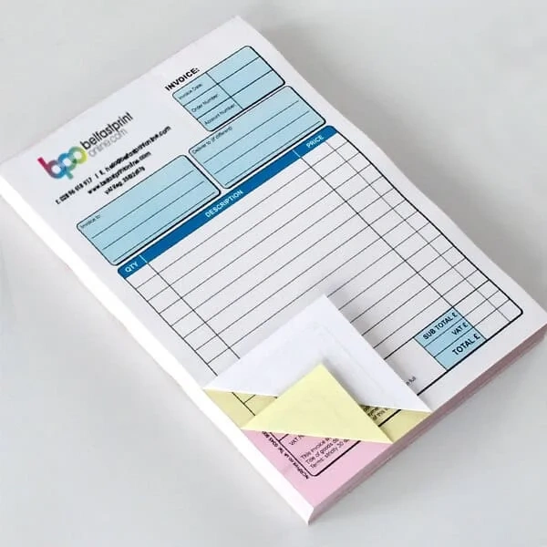 Carbonless Pads Boxes photographed at an angle to show the board thickness