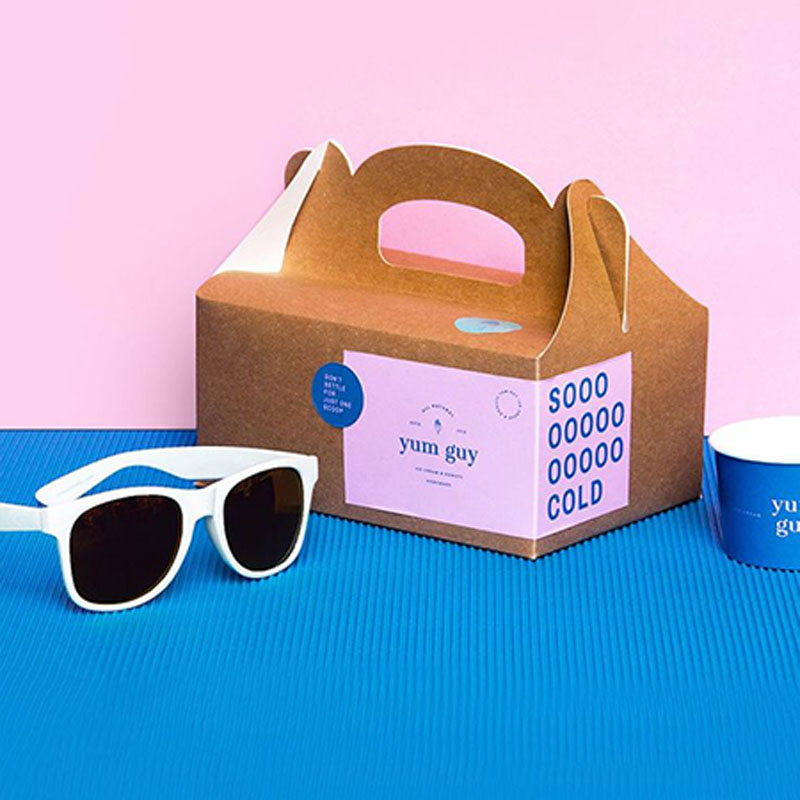 Cardboard Boxes with Handles — custom corrugated boxes by Packmio A stack of cardboard boxes with handles in a custom size