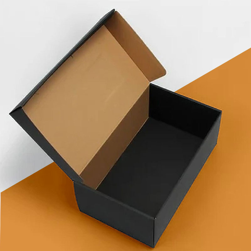 Cardboard Shoe Boxes beside the product it was made to hold