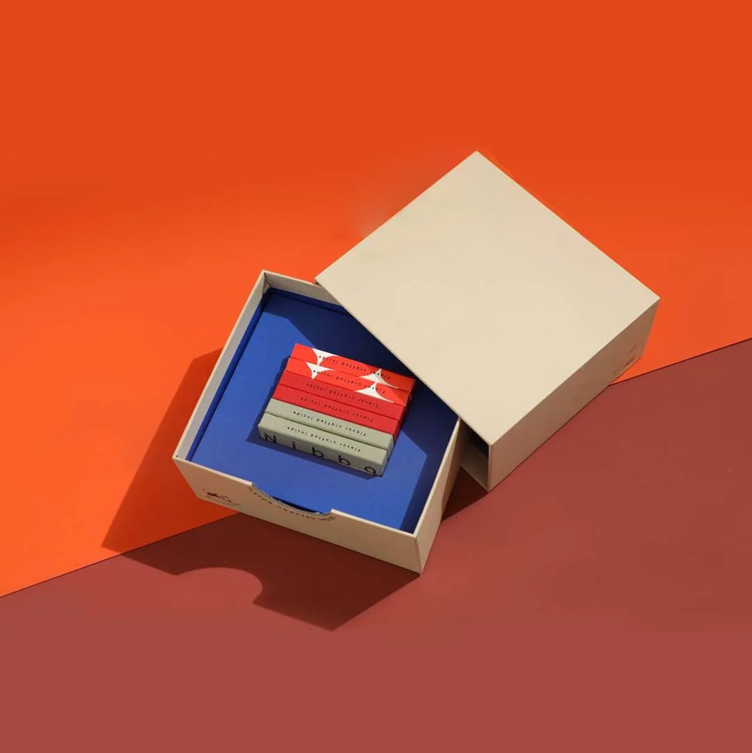 Cardboard Sleeve Boxes beside the product it was made to hold