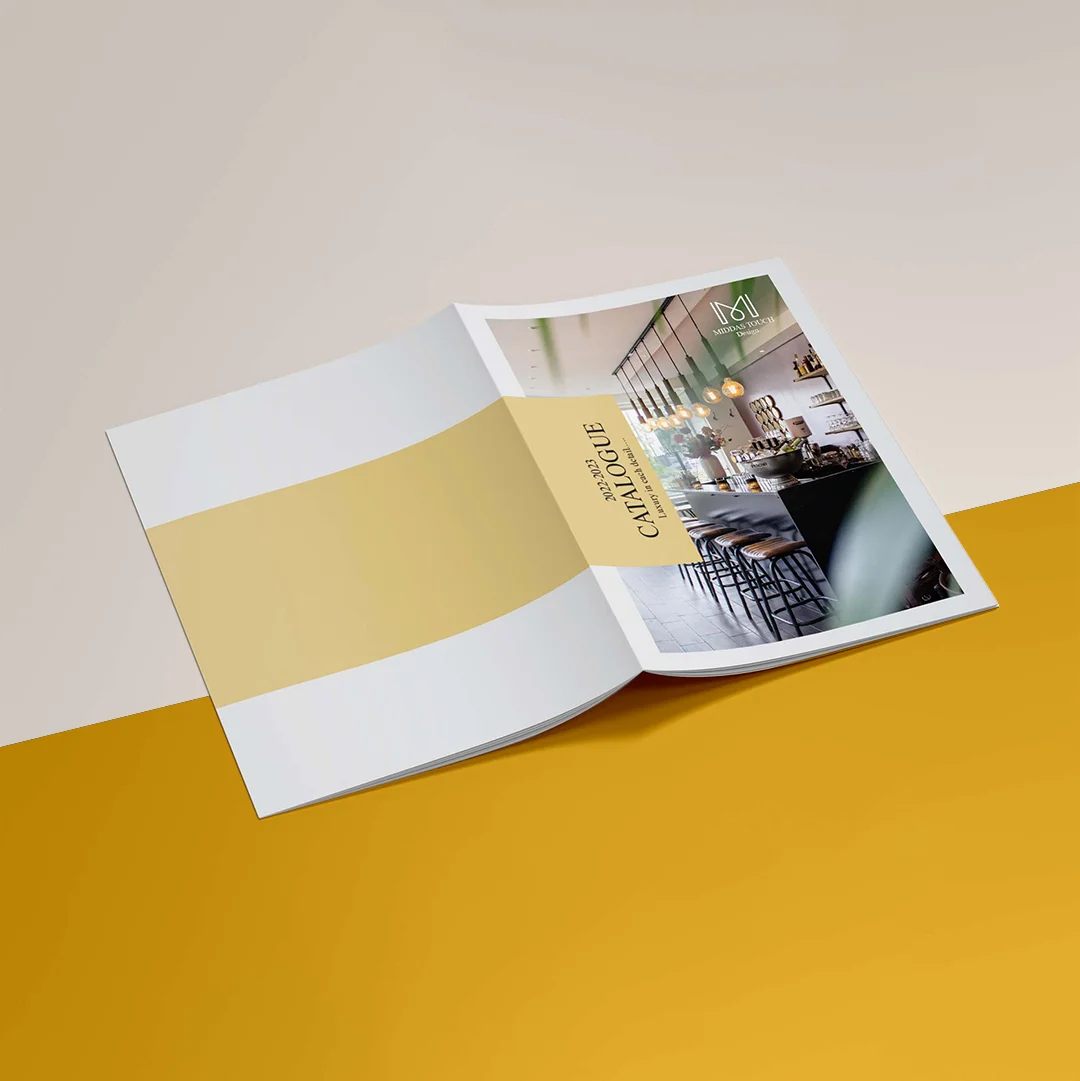 Catalog Printing — custom printing by Packmio Catalog Printing photographed at an angle to show the board thickness
