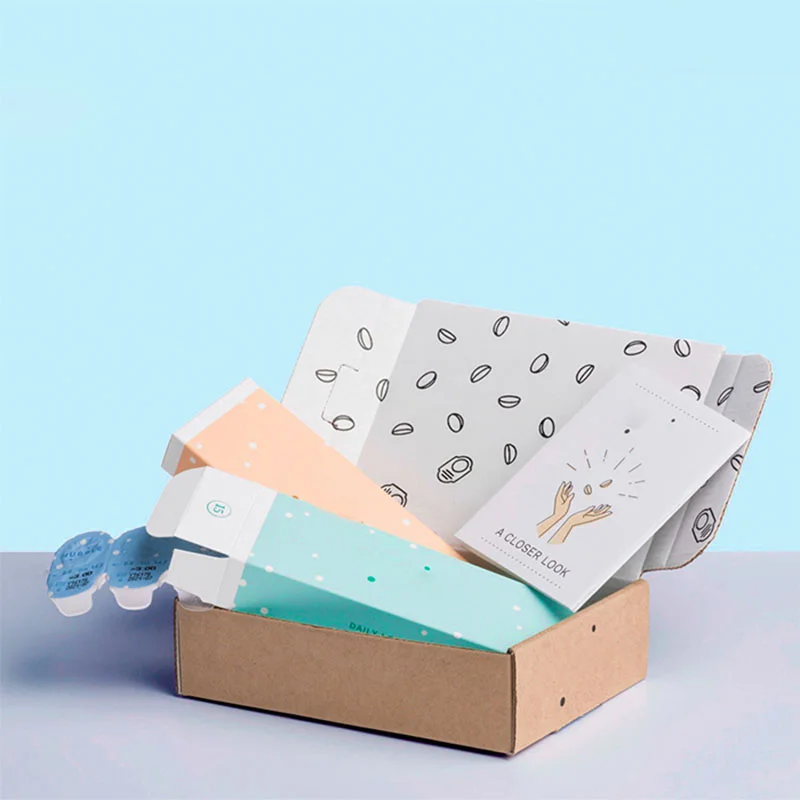 Contact Lens Boxes beside the product it was made to hold