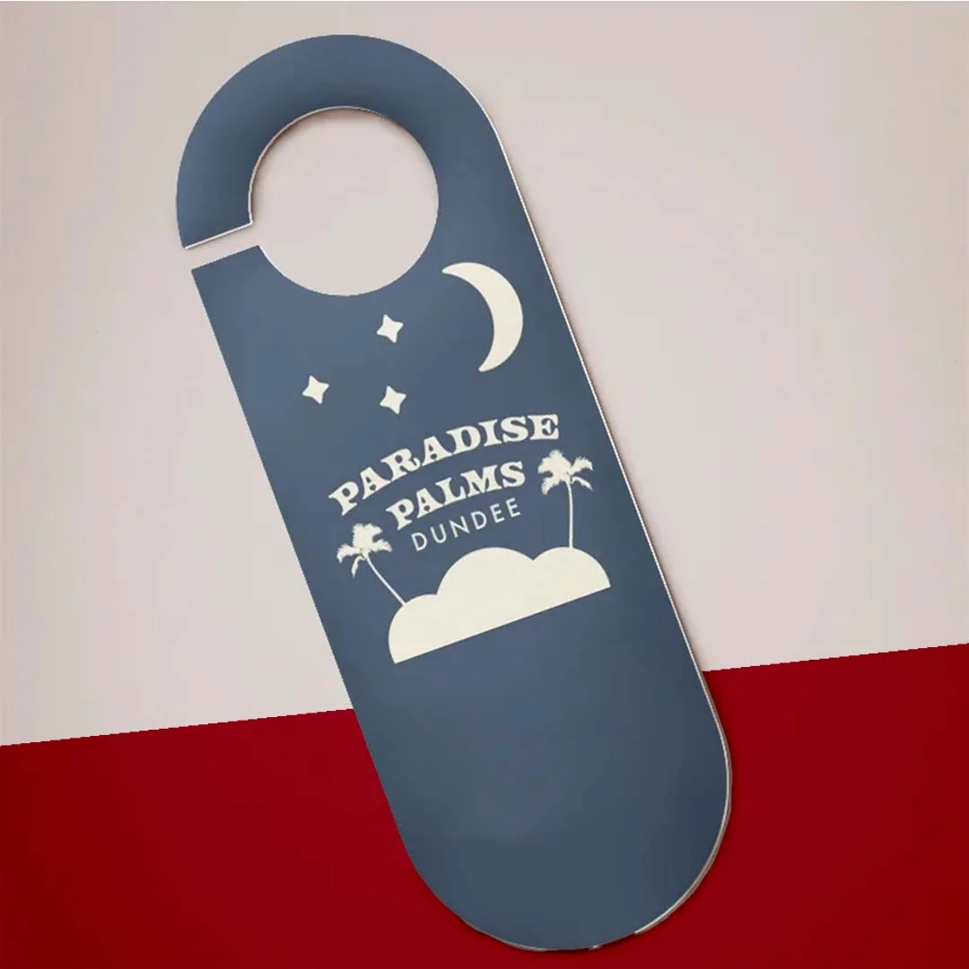 Door Hanger Flyer photographed at an angle to show the board thickness