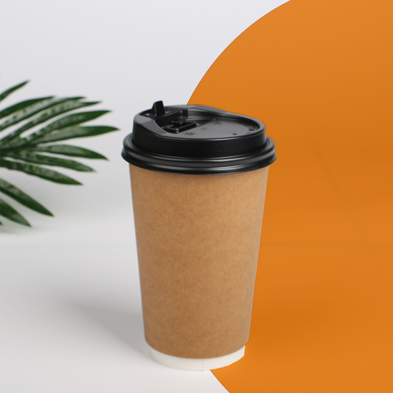 A stack of double wall paper cups in a custom size
