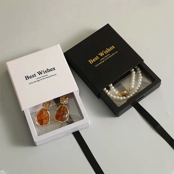 Earring Boxes — custom jewelry boxes by Packmio Earring Boxes beside the product it was made to hold