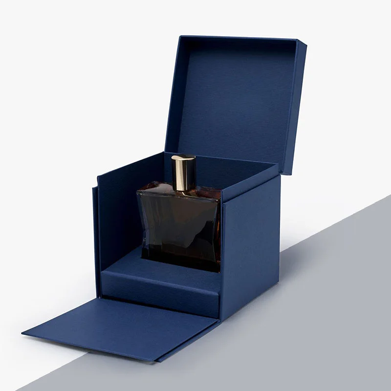 Folding Perfume Bottle Boxes beside the product it was made to hold