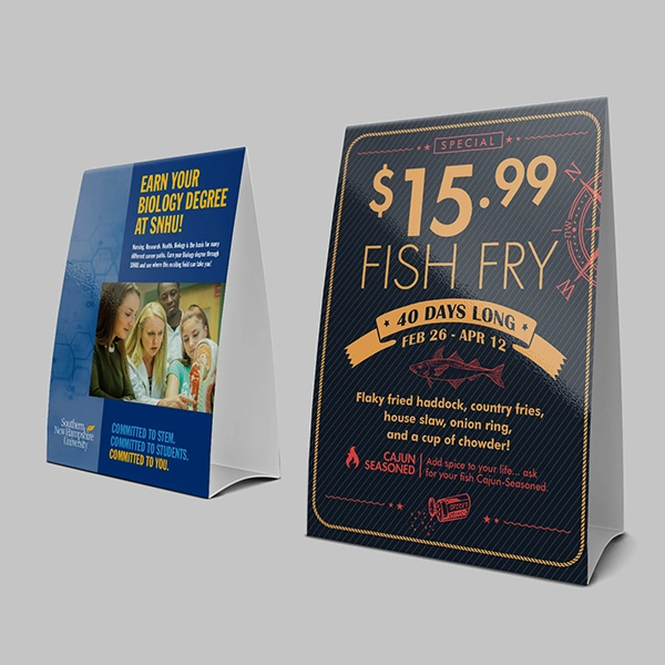 A stack of large slot table tents in a custom size