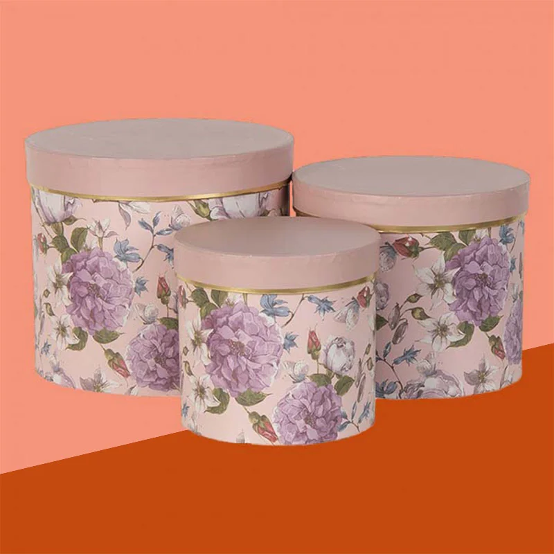 Luxury Round Boxes beside the product it was made to hold