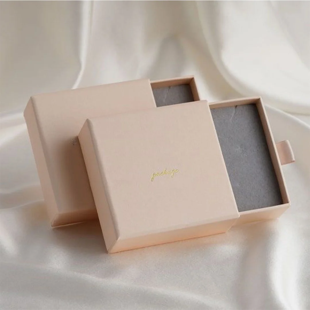 Match Style Slide Boxes — custom folding boxes by Packmio Match Style Slide Boxes in use, packed and ready to ship