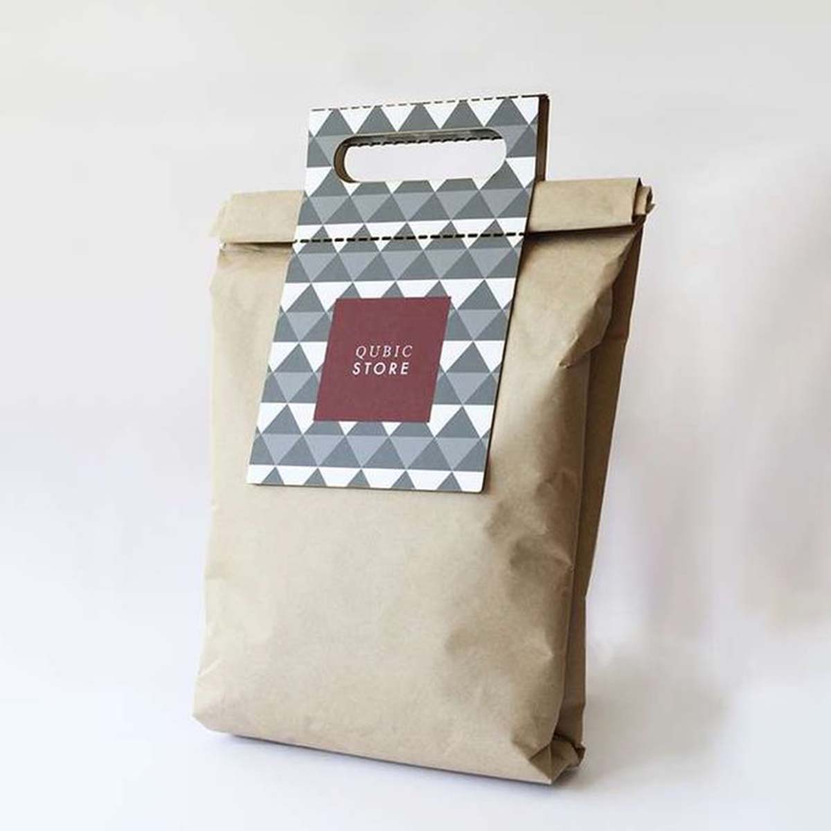 A stack of paper lunch bags in a custom size