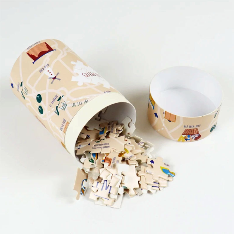 Paperboard Tube Packaging Puzzle — custom game boxes by Packmio Close detail of the print finish on paperboard tube packaging puzzle