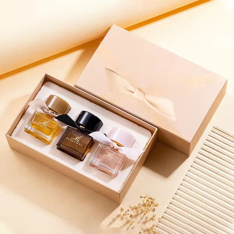 Perfume Gift Boxes beside the product it was made to hold