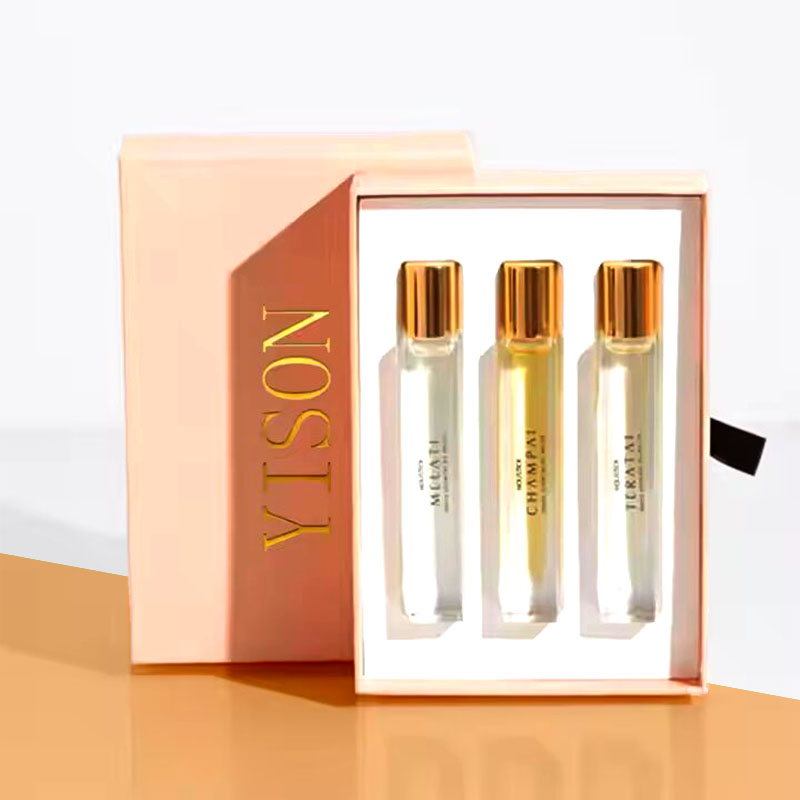 Perfume Oil Boxes beside the product it was made to hold