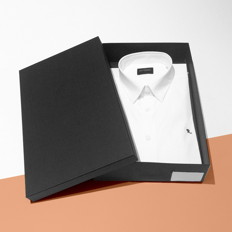 Rigid Shirt Boxes — custom rigid boxes by Packmio Rigid Shirt Boxes beside the product it was made to hold