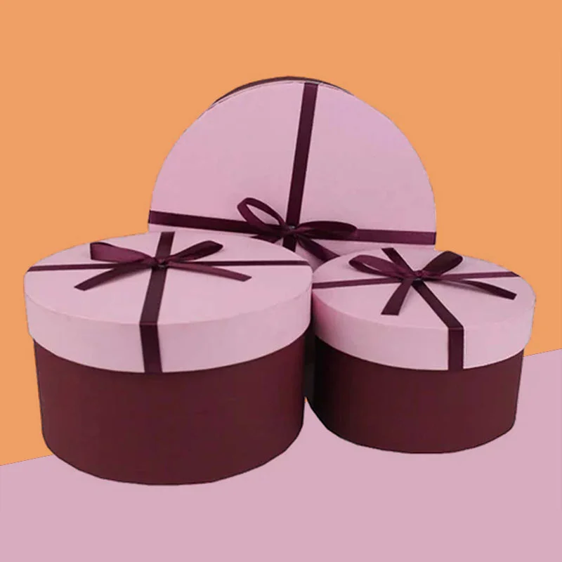 Round Gift Boxes — custom gift boxes by Packmio Round Gift Boxes beside the product it was made to hold