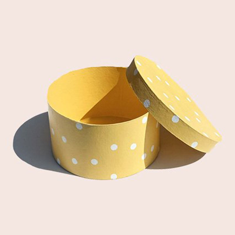 Round Kraft Boxes opened to show the inside print and construction