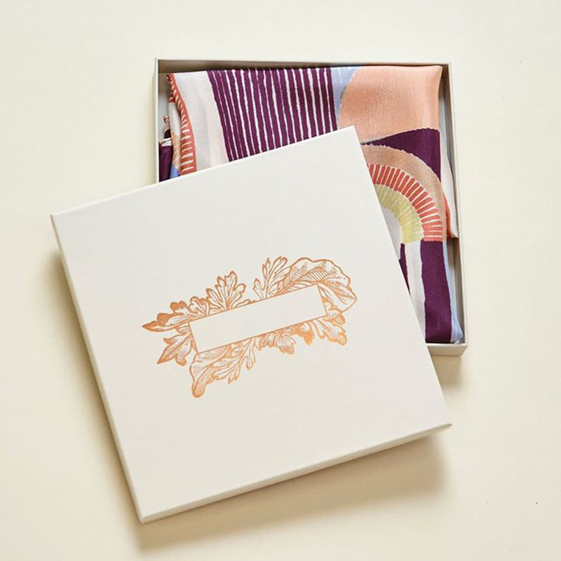 Scarf Boxes — custom apparel boxes by Packmio Close detail of the print finish on scarf boxes