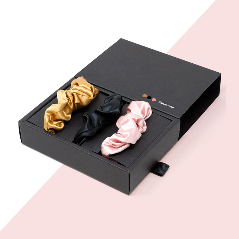 Scrunchie Boxes — custom apparel boxes by Packmio Scrunchie Boxes in use, packed and ready to ship