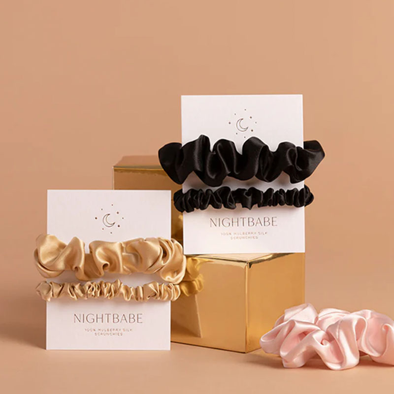 Scrunchie Boxes — custom apparel boxes by Packmio Close detail of the print finish on scrunchie boxes