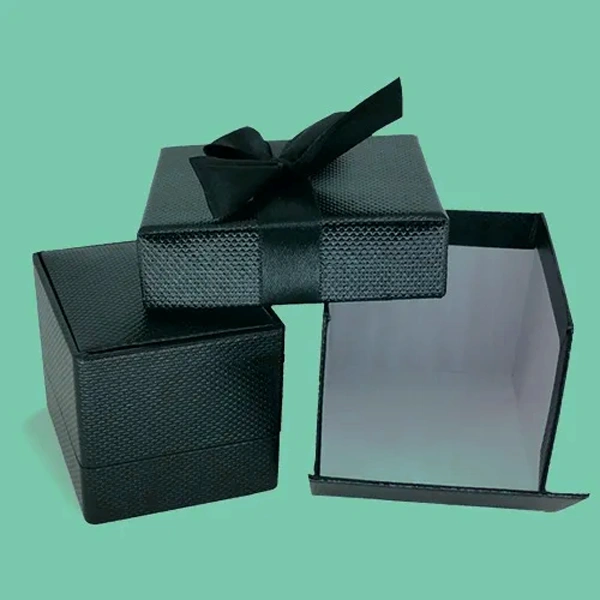 Textured Cardstock Boxes beside the product it was made to hold
