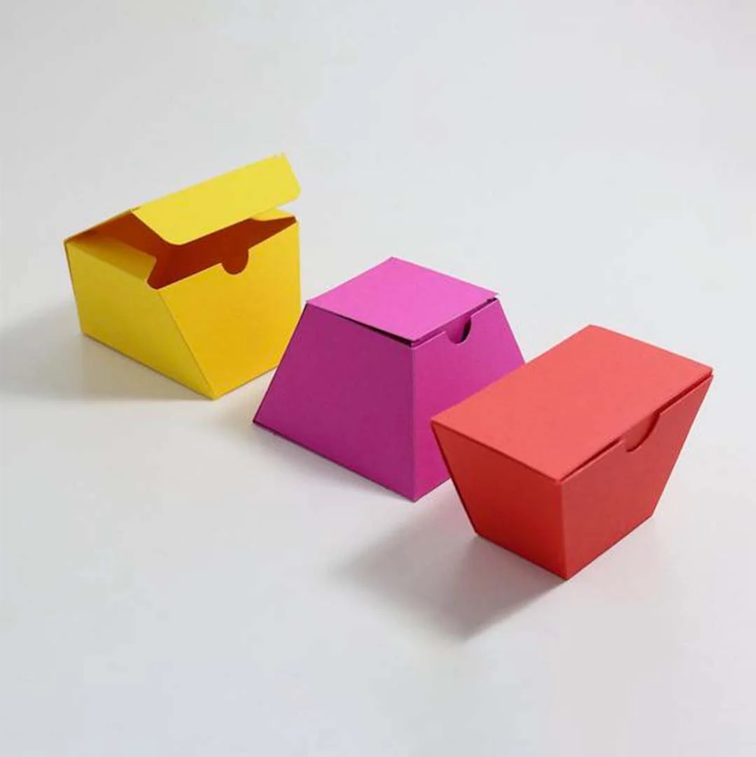 Trapezoid Boxes — custom folding boxes by Packmio Trapezoid Boxes beside the product it was made to hold