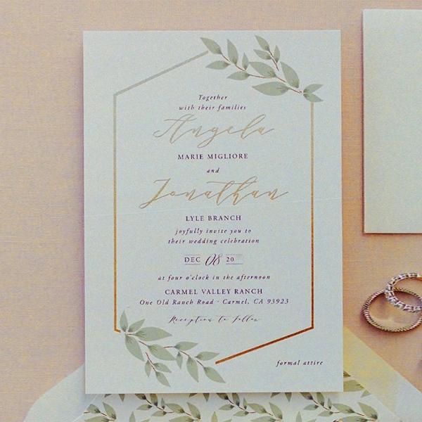 A stack of wedding invitation cards in a custom size